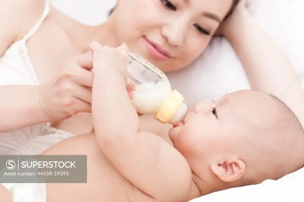 Happy mother to breastfeed her child