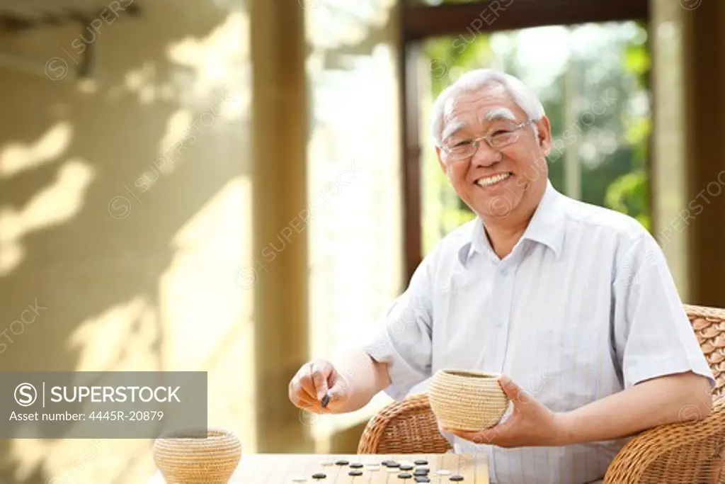 Happy elderly chess