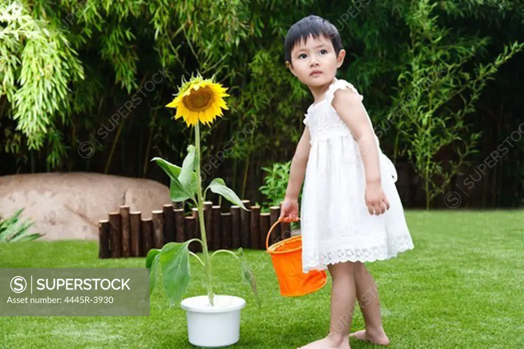 Little girl with a sunflower