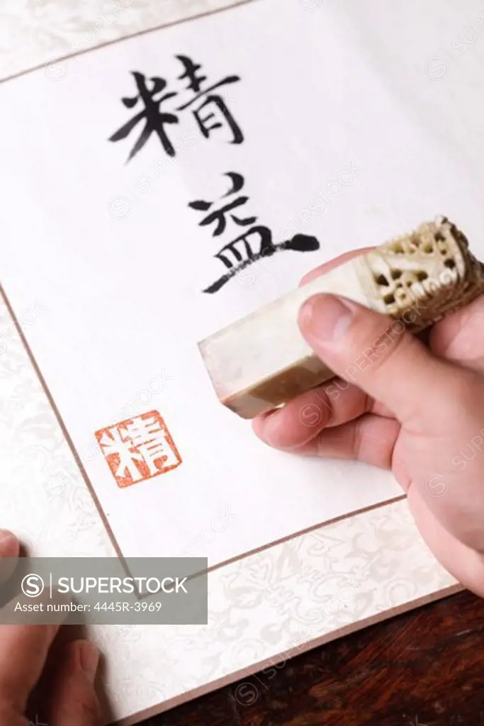 Calligrapher holding a stamp