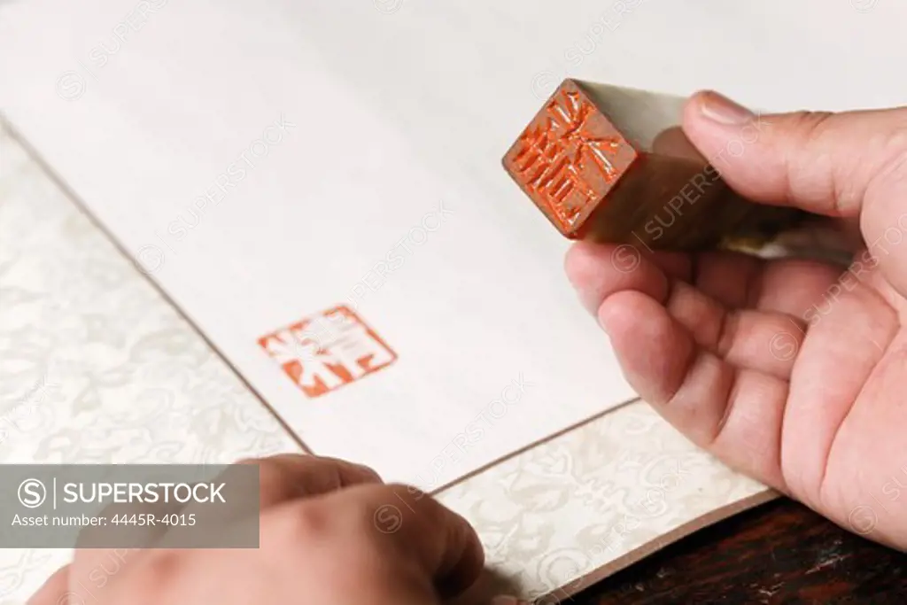 Calligrapher holding a stamp