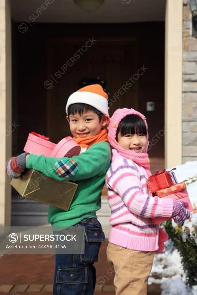 Children holding gift boxes