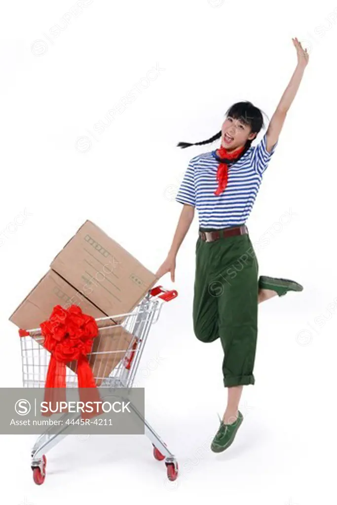 Young woman pushing shopping cart