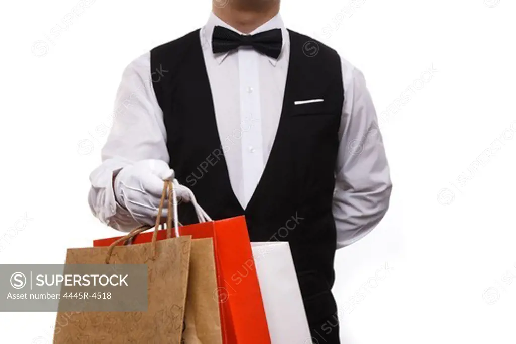 Waiter carrying shopping bags