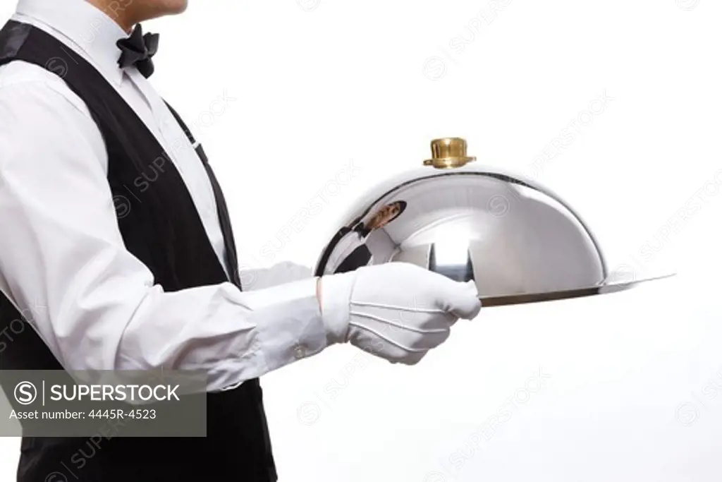Waiter carrying silver tray