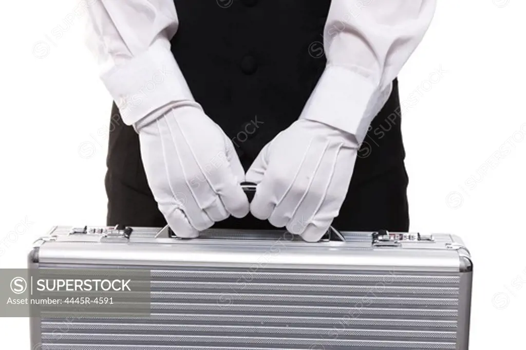 Waiter carrying suitcase