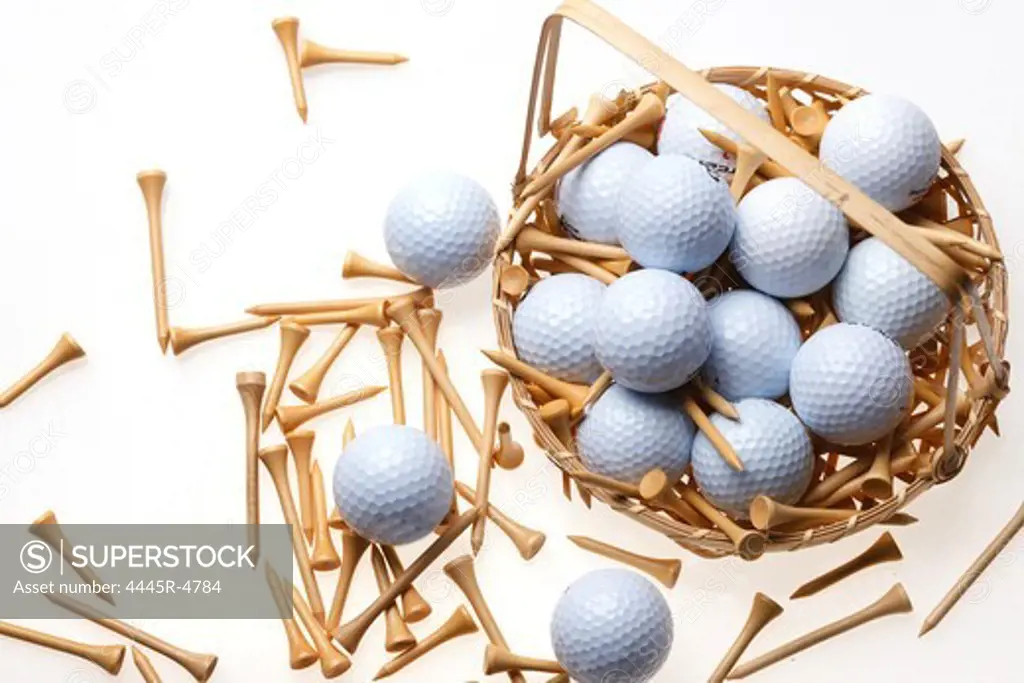 A basket of golf balls and tees