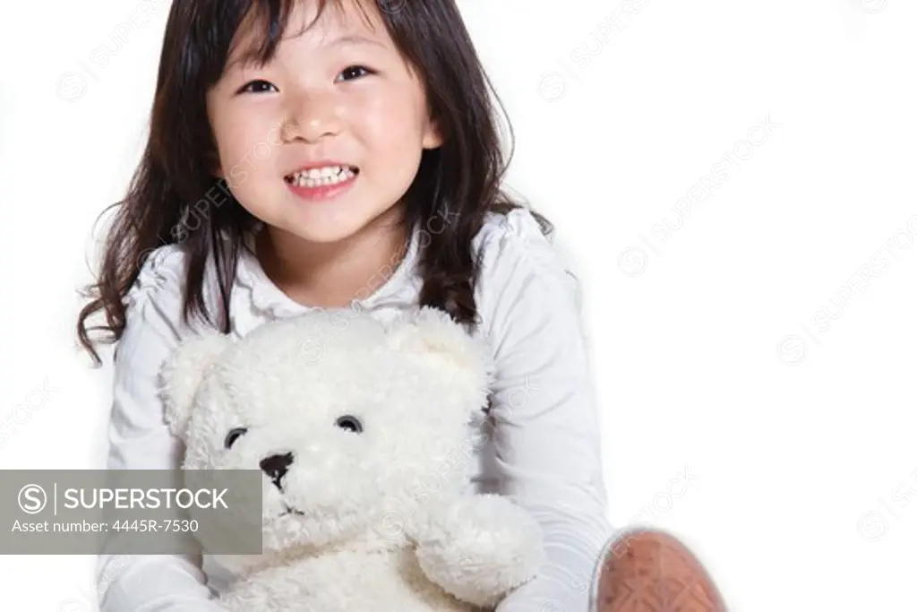 Girl holding toy bear