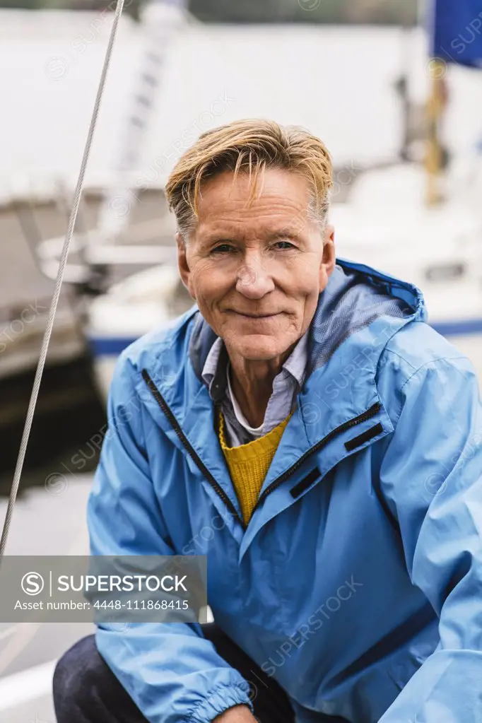 Portrait of confident senior man attending boat master course