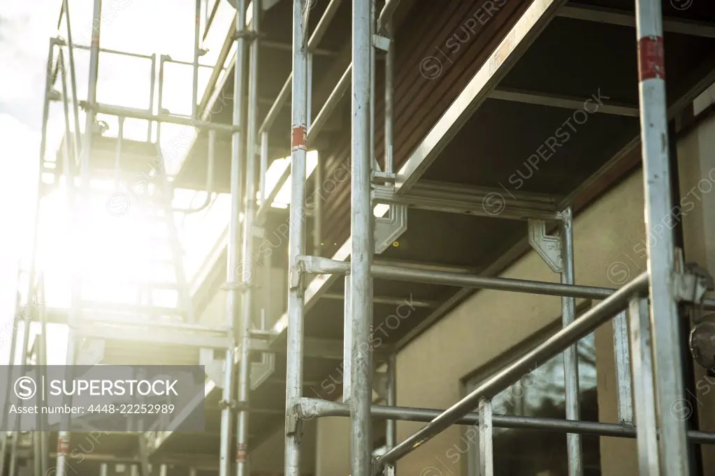 Low angle view of scaffolding outside house on sunny day