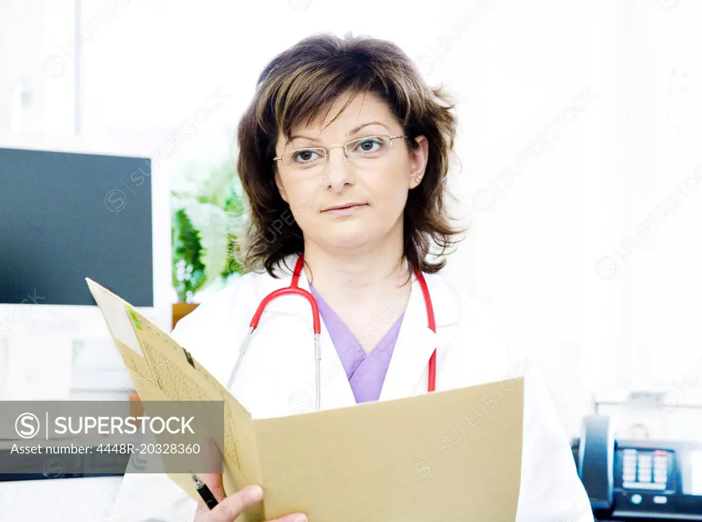 Female doctor with a journal in her hands
