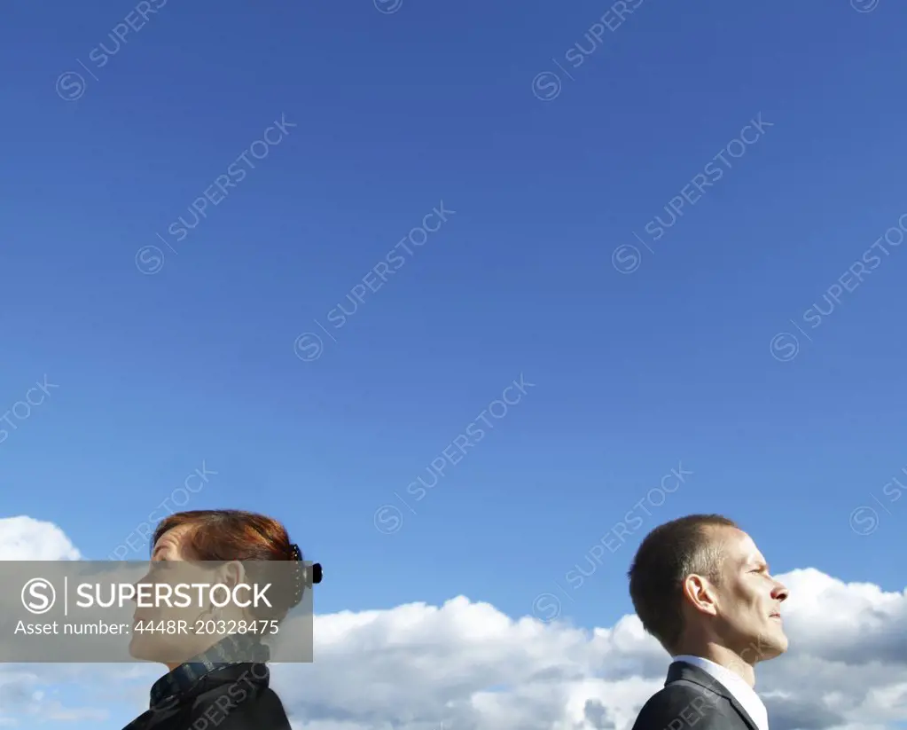 Businessman and businesswoman outdoors