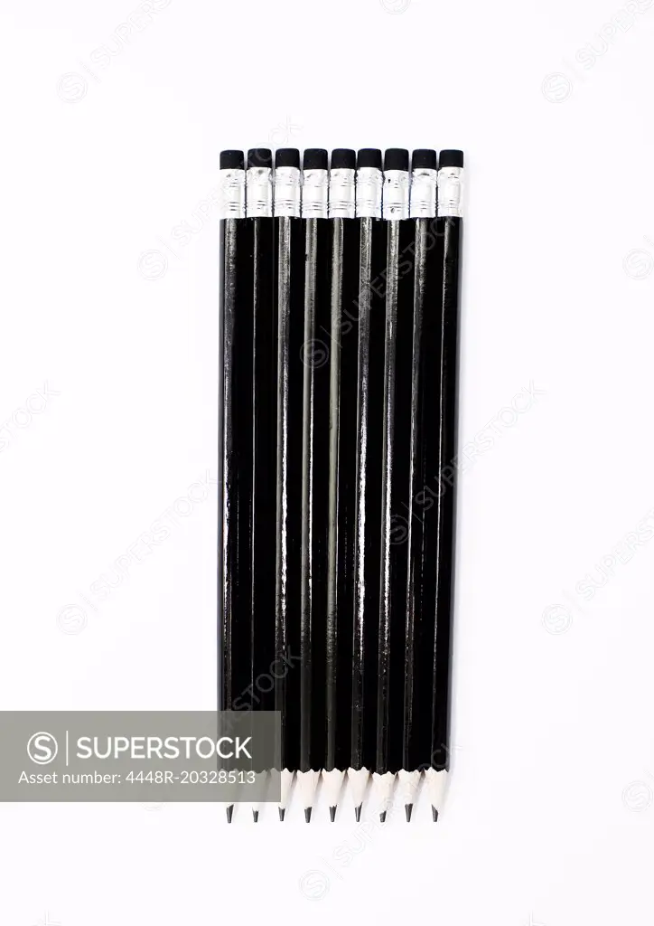 Nine black pencils