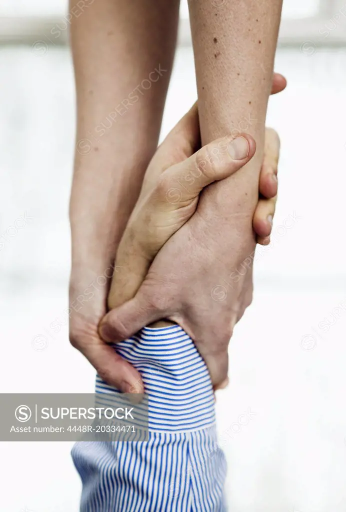 Closeup on helping hands