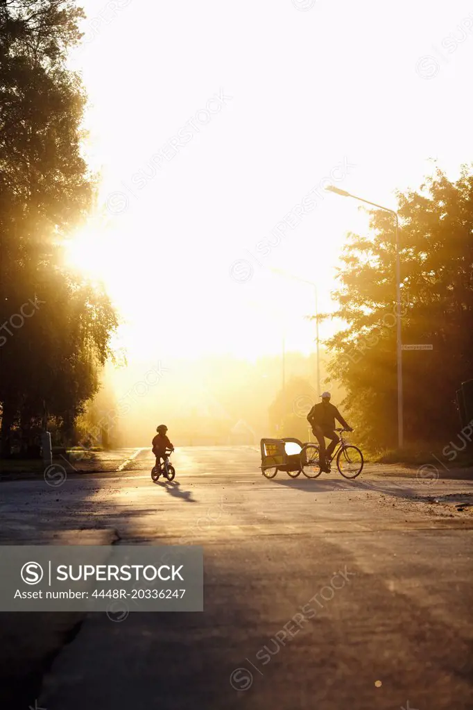 Two biking in sunshine