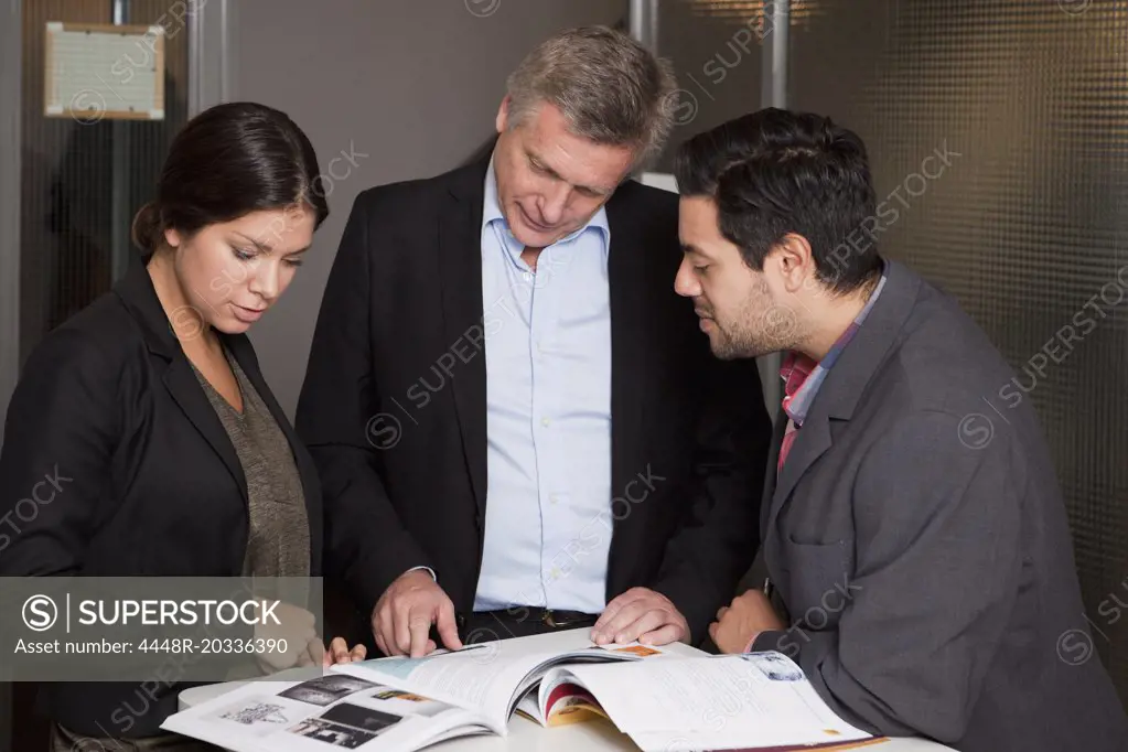 Three colleagues discussing