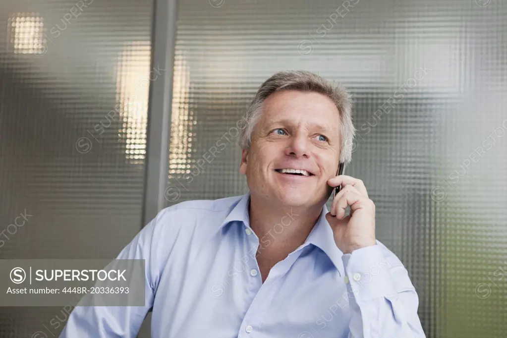 Happy man in telephone