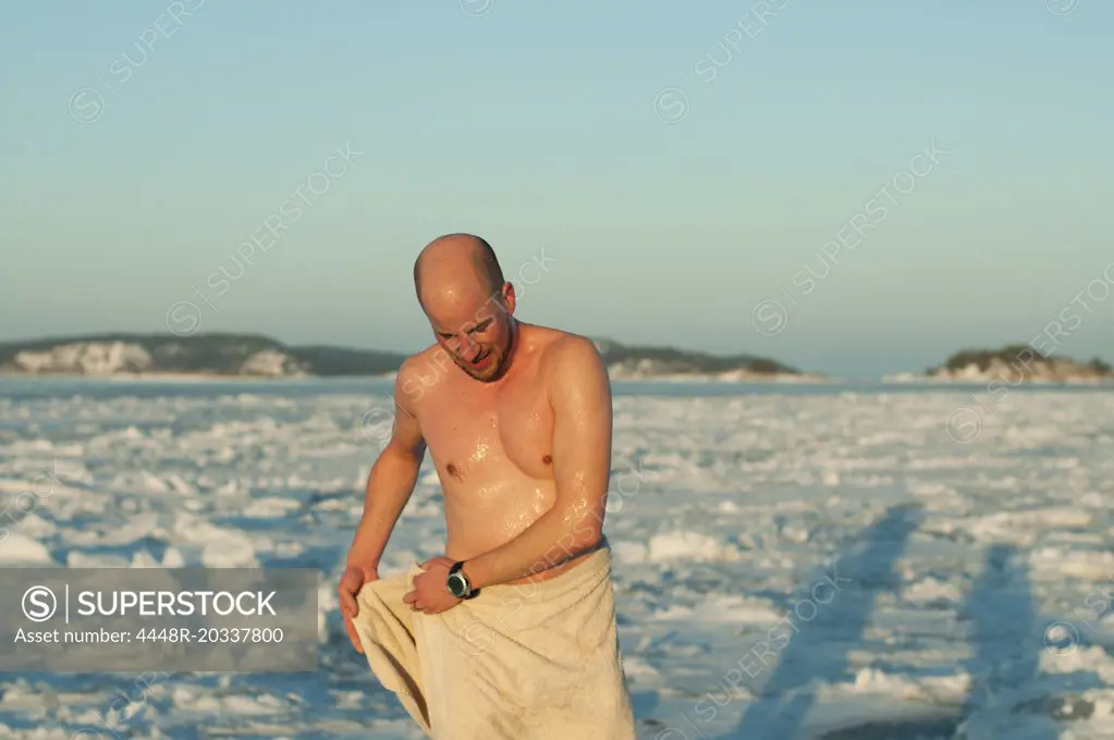 Man bathing in ice
