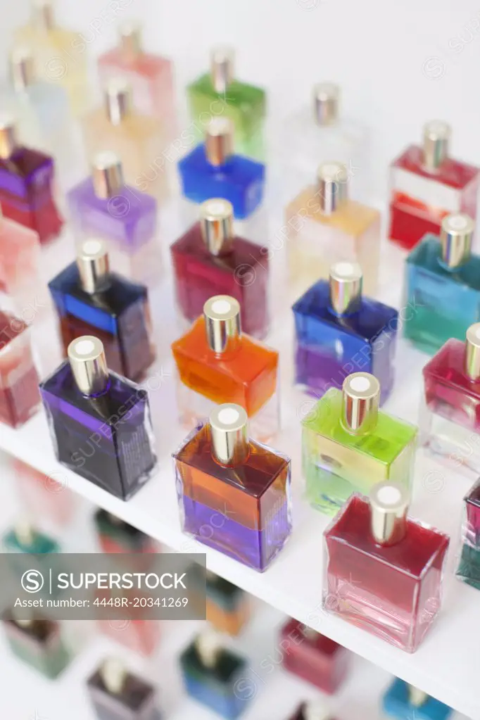 Close-up of multicolored scented perfume bottles in spa
