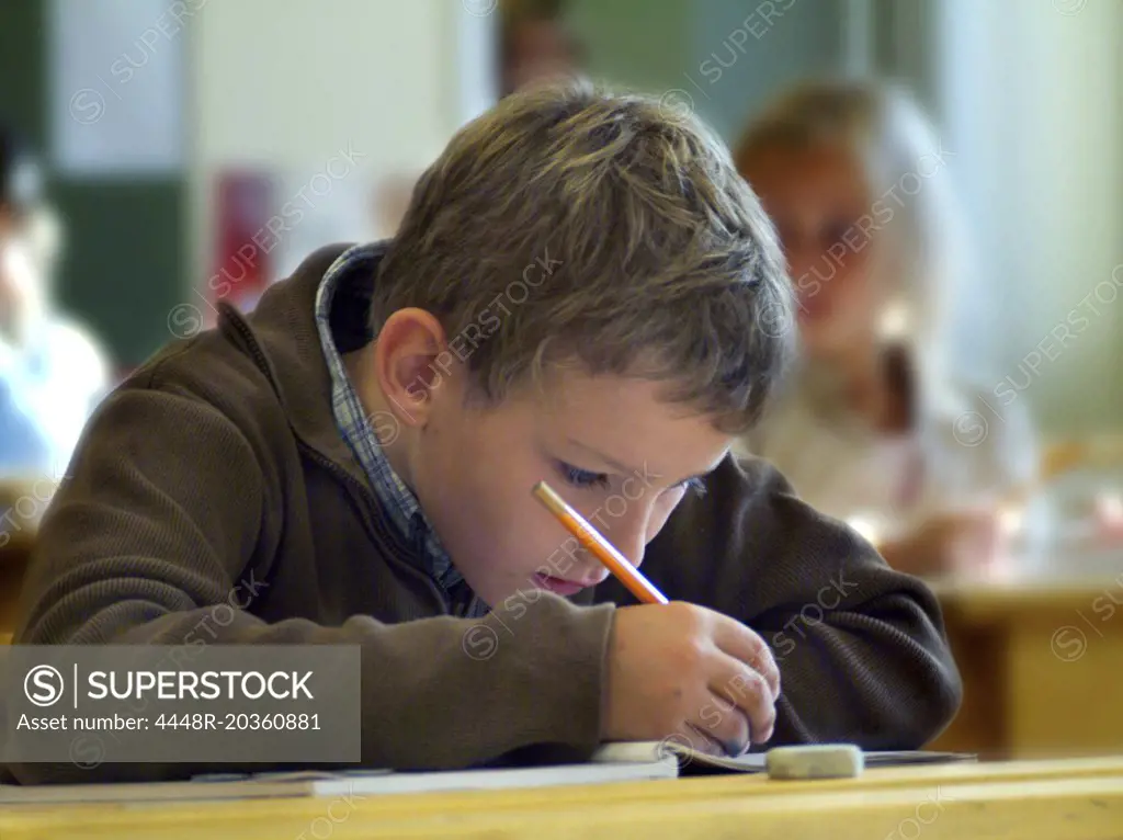 Concentrated boy in classroom