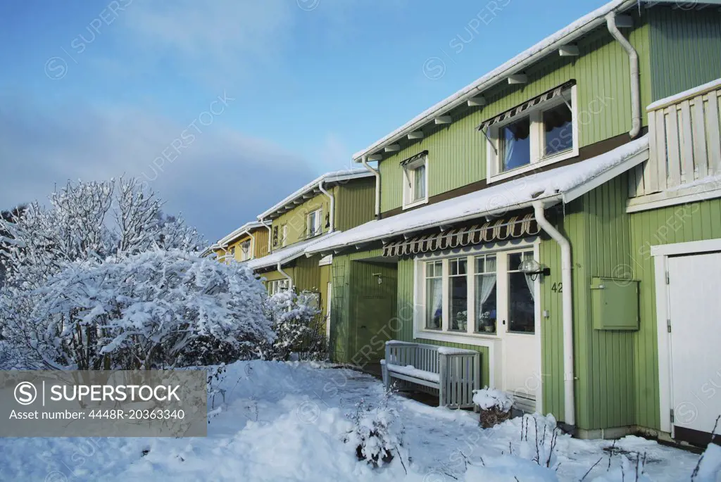 Terrace house covered in snow
