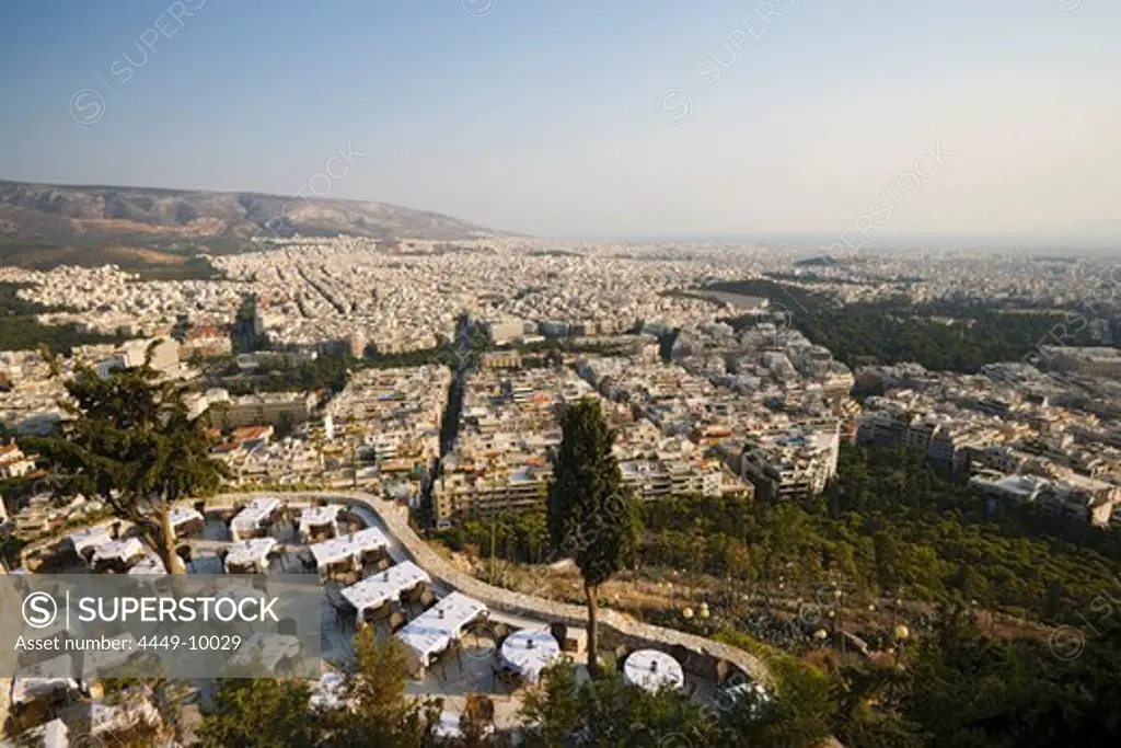 View from the Lykavittos Hill over a restaurant to the ocean of houses of the town, Athens, Athens-Piraeus, Greece