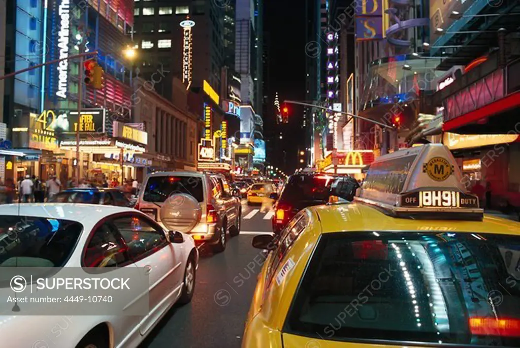 Cars and illuminated advertising at night, 42nd Street &amp;amp;amp; Times Square, Manhattan, New York, USA, America