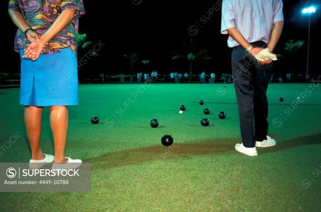 Two people playing lawn bowls, Suva, Fiji Island, Polynesia
