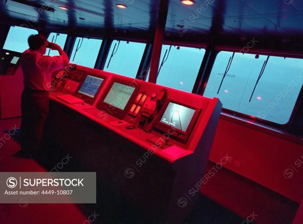 Screens and radars on the command bridge of the Queen Mary 2, Cruise Ship