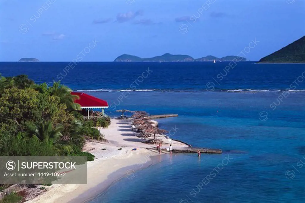 Sandy beach with sunshades in the sunlight, Marina Cay, British Virgin Islands, Caribbean, America