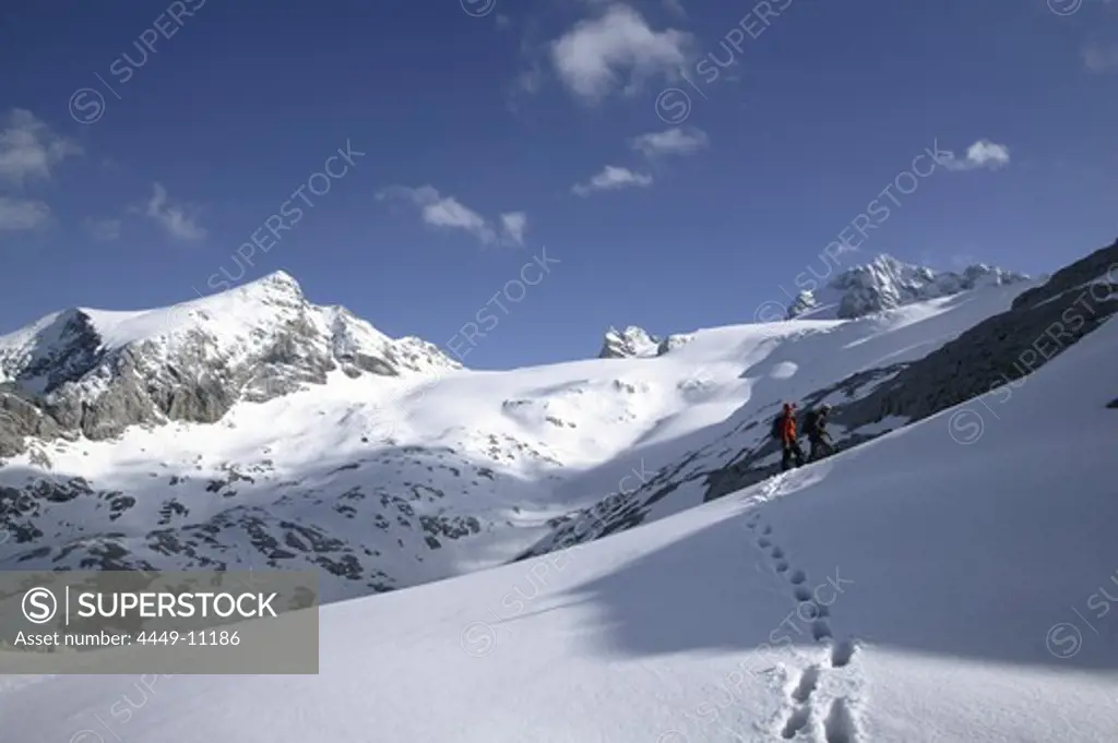 Two mountaineers walking to Schoeberl, Hallstaetter Glacier, Dachstein, Austria