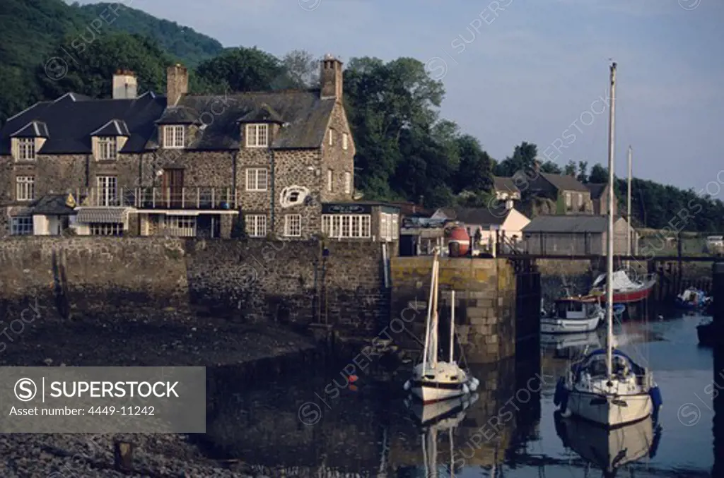 Boats in the harbour of small fishing village Porlock Weir, Somerset, England