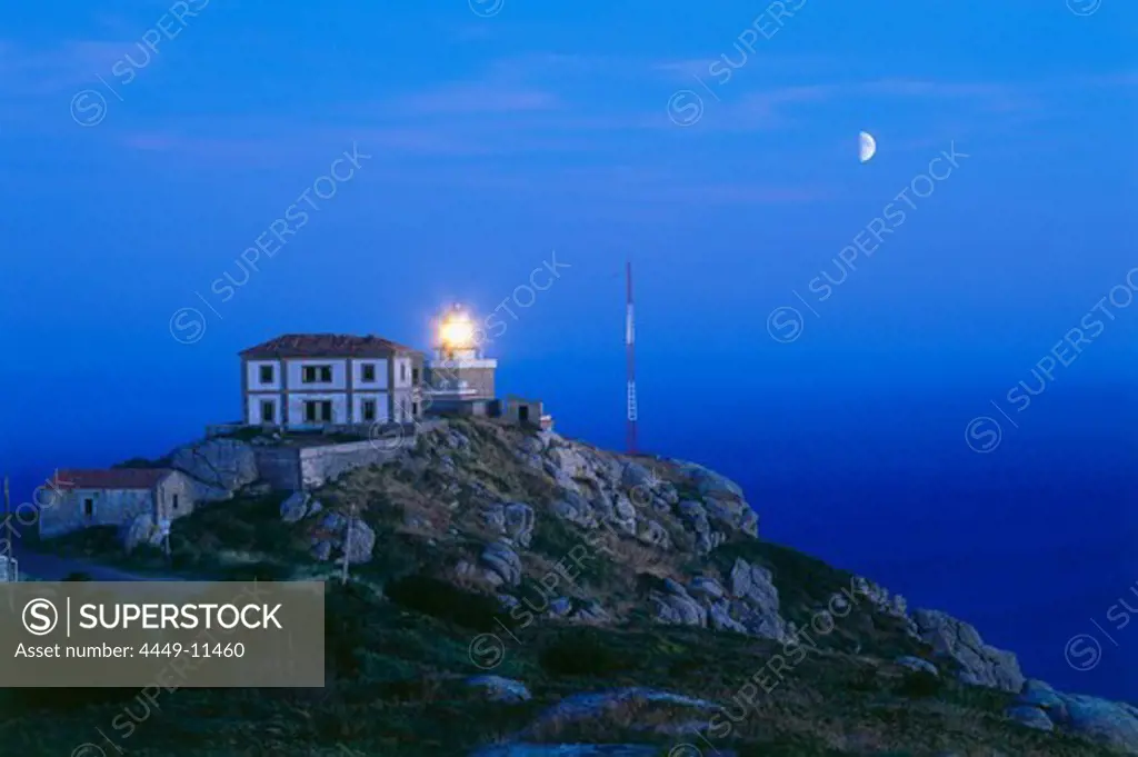 Lighthouse and moon, Cabo Finisterre, Province La Coruna, Galicia, Spain