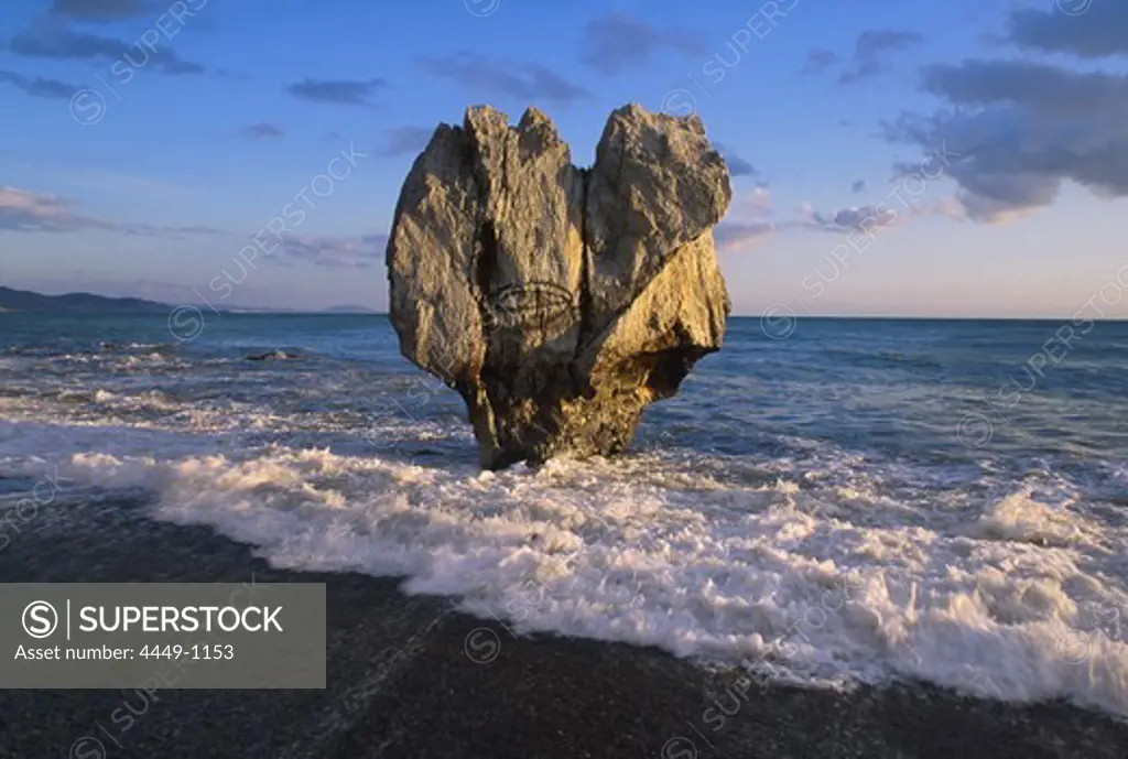 Rock in the surge in the light of the setting sun, Palm Beach, Preveli, Crete, Greece