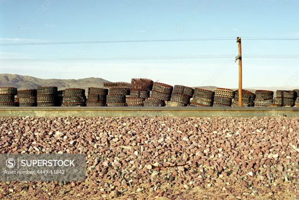Rusty tracks of tracked vehicles and train tracks, Mojave Desert, California, USA
