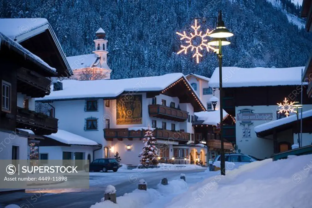View along a street with christmas decoration in the evening, Flachau (927 m), Salzburger Land, Austria