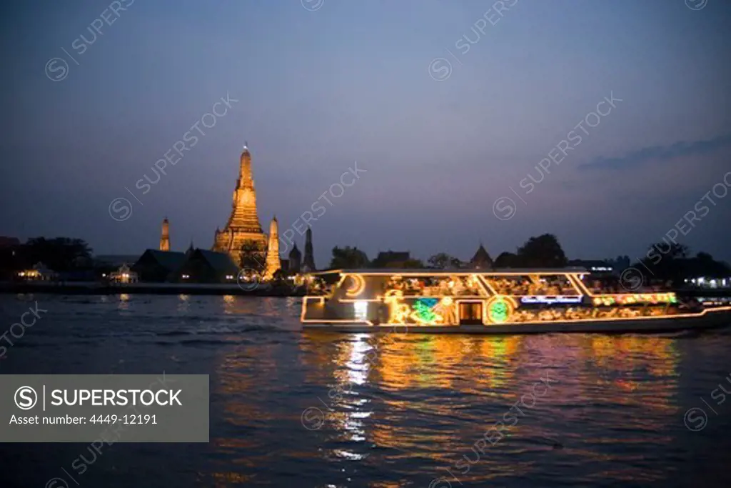 View over the river Menam Chao Phraya with a restaurant ship to Wat Arun, Temple of Dawn, Bangkok, Thailand