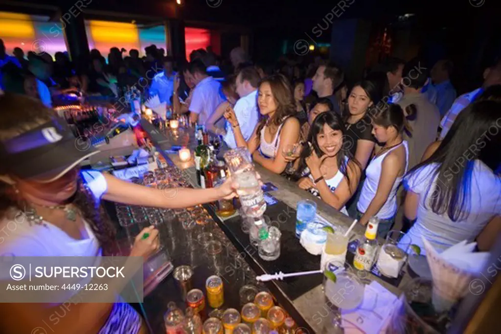 Female bartender mixing a cocktail for a woman, Q-Bar, a trendy bar for locals and expats, TH Sukhumvit, Bangkok, Thailand