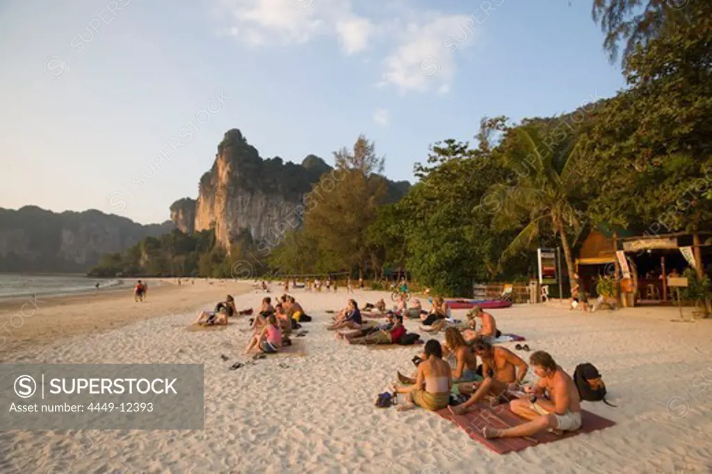 People sitting at white sandy beach of Hat Rai Leh, Railay West, Laem Phra Nang, Railay, Krabi, Thailand, after the tsunami