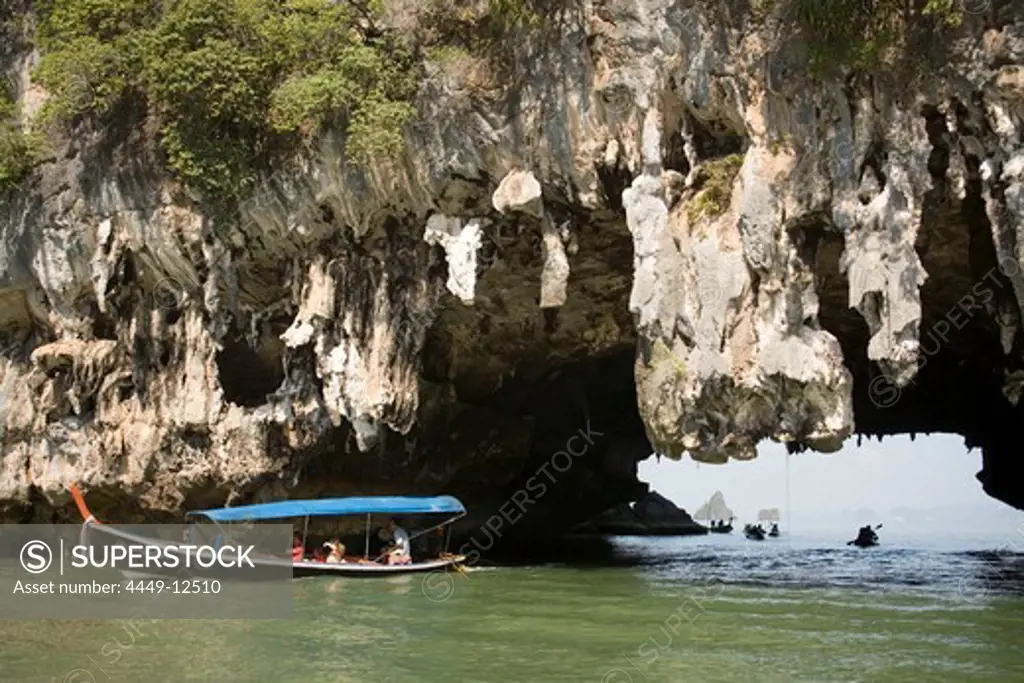 Boat passing a Karst formation, Phang-Nga Bay, Ao Phang Nga Nation Park, Phang Nga, Thailand