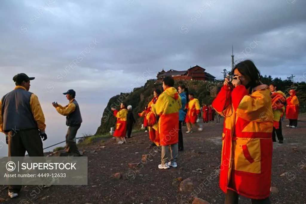 pilgrims and tourists, early morning sunrise and sea of clouds, 3077 metre altitude, Golden Summit, summit of Emei Shan mountains, World Heritage Site, UNESCO, China, Asia