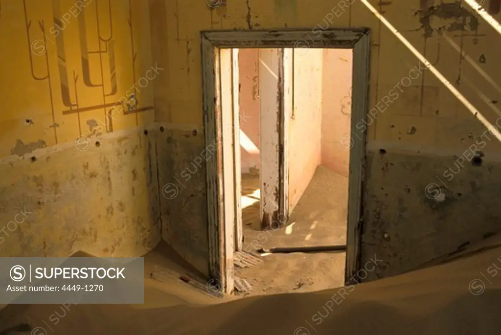 Abandoned house full of sand, Former mining village, now a ghost town, Kolmanskop, Namibia, Africa