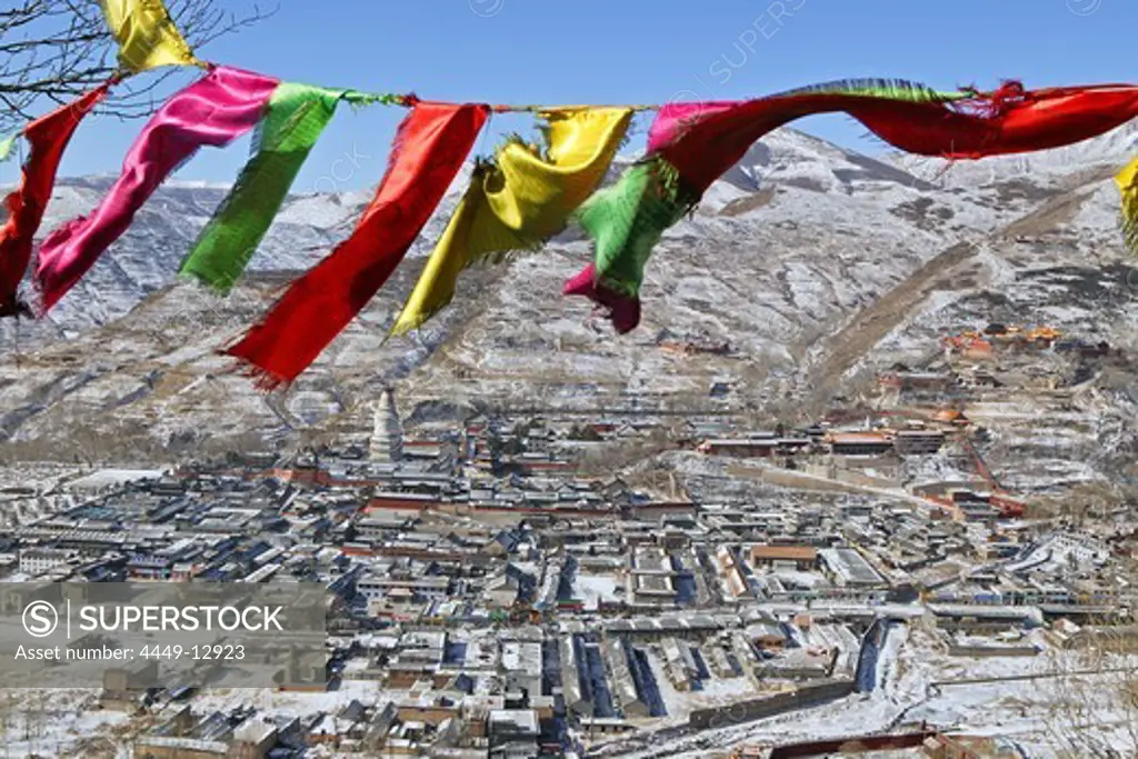 Tibetan prayer flags, view above the town of Taihuai and Wutai Shan Mountains in winter, Mount Wutai, Shanxi province, China