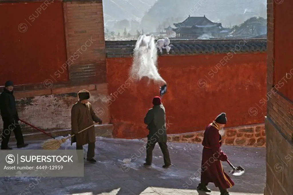 Monks clearing snow, high walls of monastery, Xiantong Monastery, Wutai Shan, Five Terrace Mountain, Buddhist Centre, town of Taihuai, Shanxi province, China