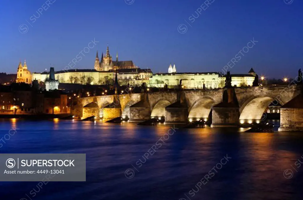 Vltava river and Charles Bridge at night with Prague castle in the background, Prague, Czech Republic