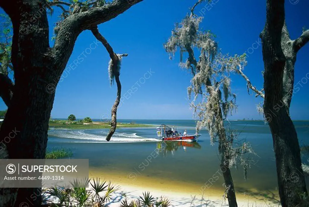 People on a boat near to the bank, Cedar Key, Florida, USA, America