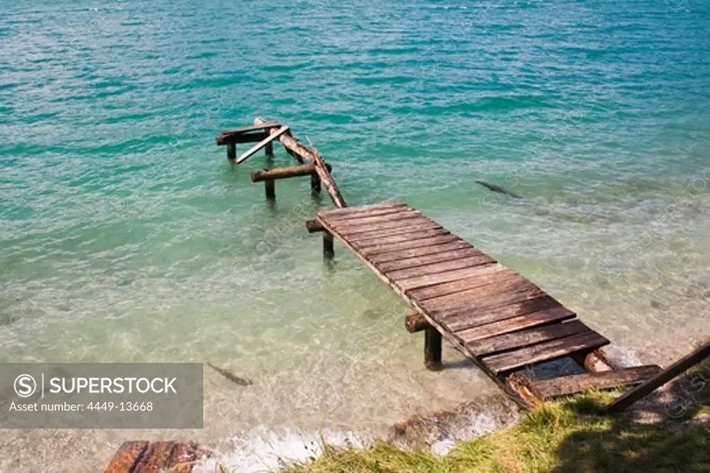Derelict footbridge at lake, Upper Bavaria, Germany