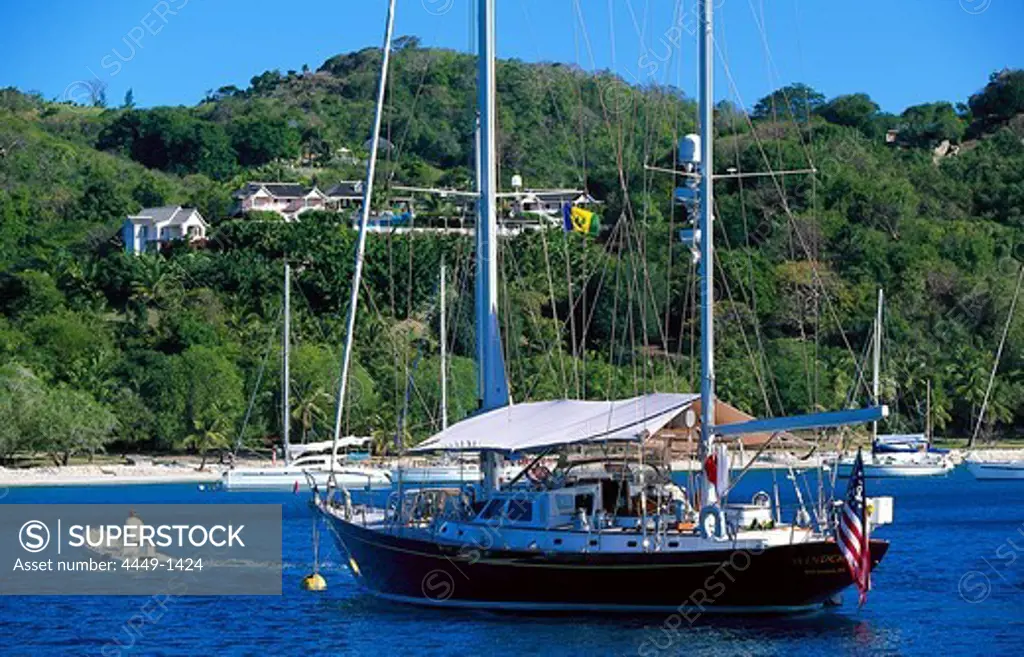 Sailing boat at Britania Bay off Mustique island, St. Vincent, Grenadines, Caribbean, America