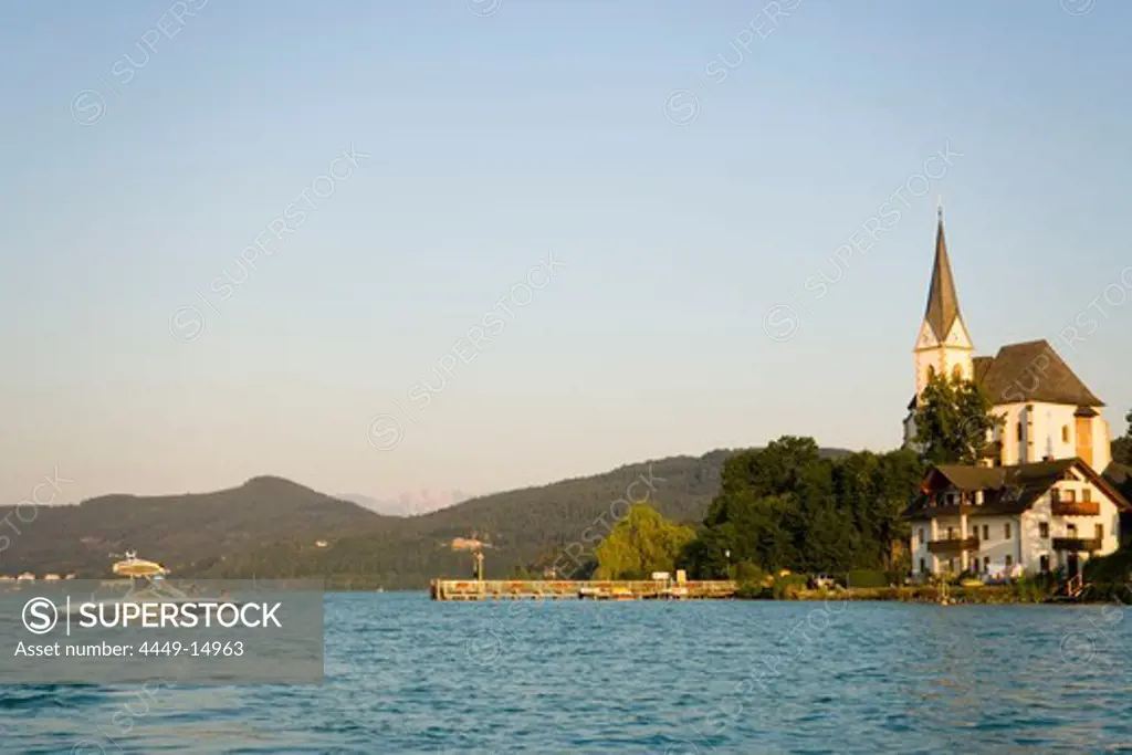 View over Woerthersee (biggest lake of Carinthia) to parish church, Maria Woerth, Carinthia, Austria