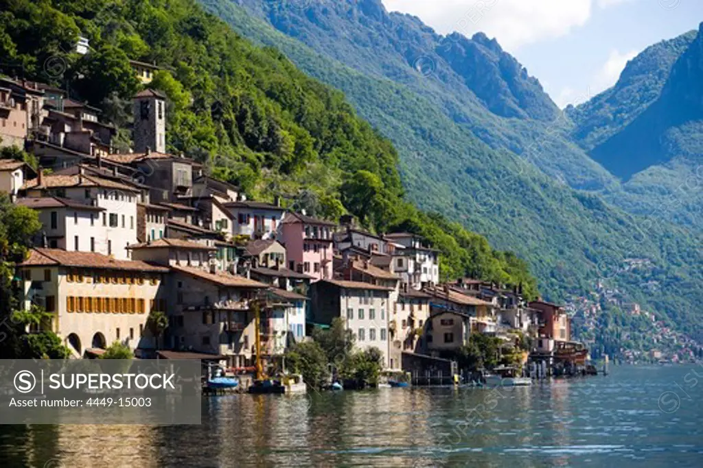 View over Lake Lugano to picturesque village Gandria at mountainside of mount Monte Bre, Lugano, Ticino, Switzerland